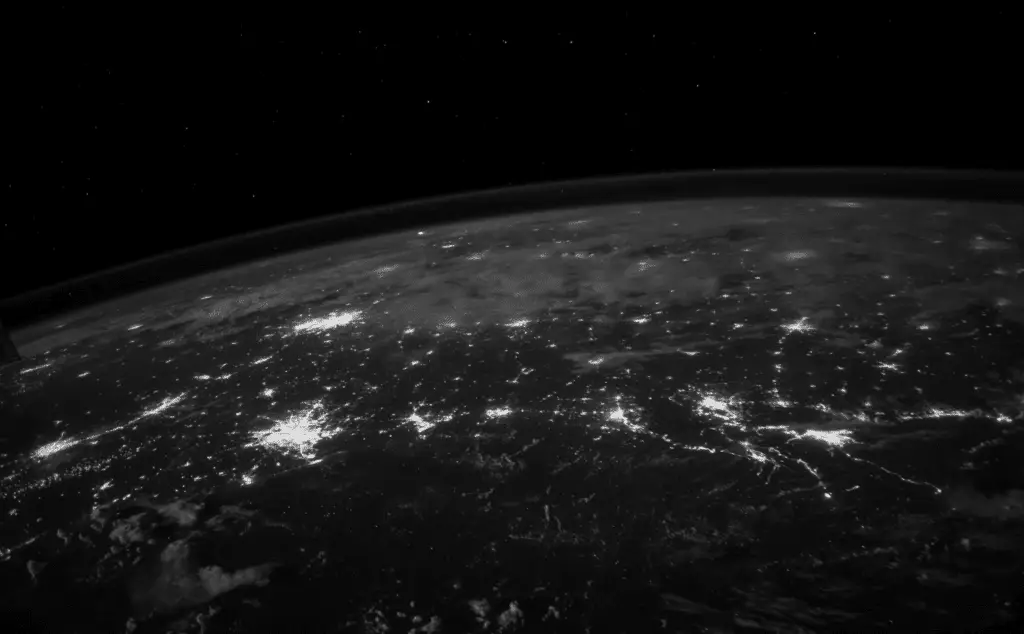 This NASA image of the earth's surface from space, with different hubs illuminated by electricity, shows the international and even global nature of DNS server solutions.