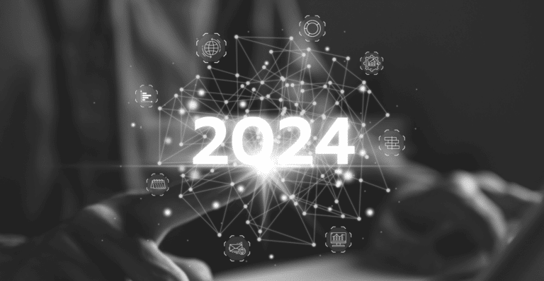 This image of a person over a computer and the word 2024 appearing digitally from their fingertip highlight's this article's topic of welcoming the new year's digital trends.