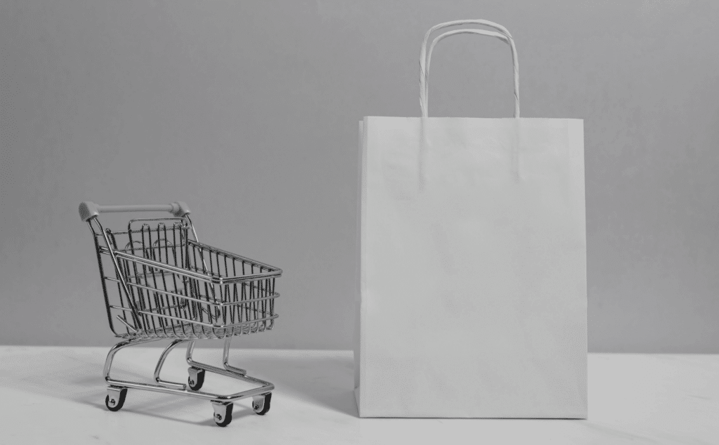 This image of a cart and shopping bag highlights this post's topic: a fake shop finder.