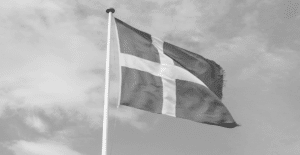 This image of the Danish flag highlights this discussion's topic: the state of scams in Denmark report.