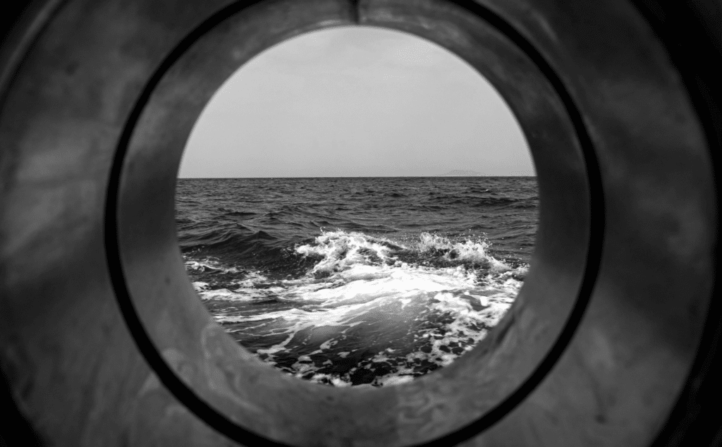 This image of a view through a porthole illustrates the blog's topic: building a complete domain strategy.