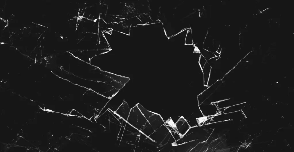 this image of a fractured hole in an unknown material, possibly in glass, with a black backdrop highlights the discussion's topic: the impacts of domain shadowing.