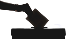 This silhouette of a hand putting a vote into a ballet box highlights our discussion topic: Cyberattacks during the election, and what brands can learn from them.