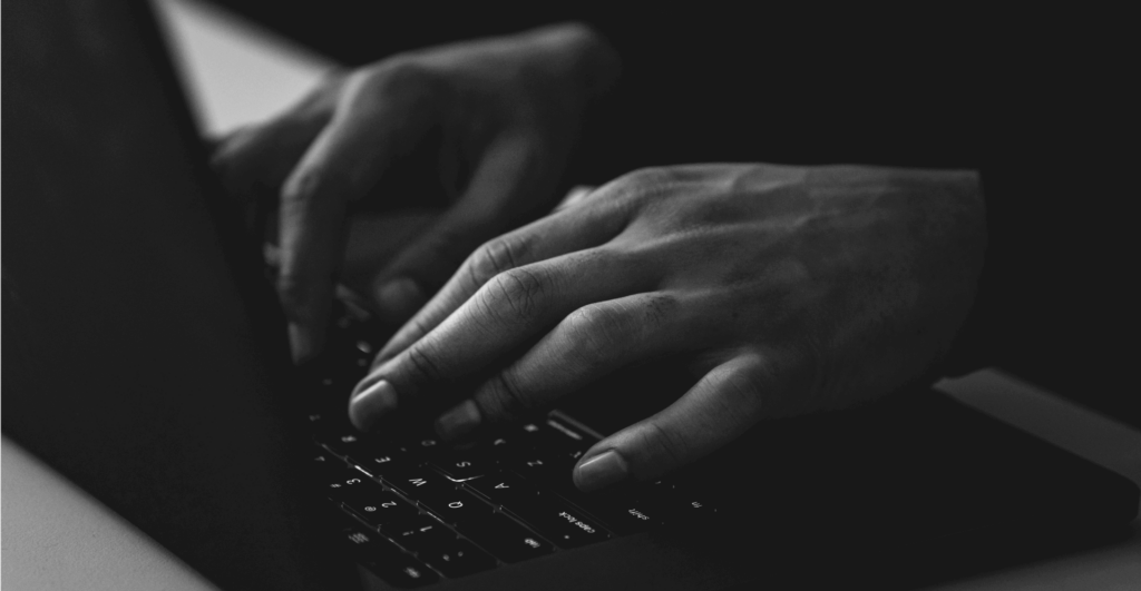 This image of hands at a keyboard illustrates our discussion topic: fake shops online.