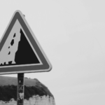 This image of a warning sign on the edge of a cliff illustrates this guide's discussion topic: the pitfalls of brand protection.