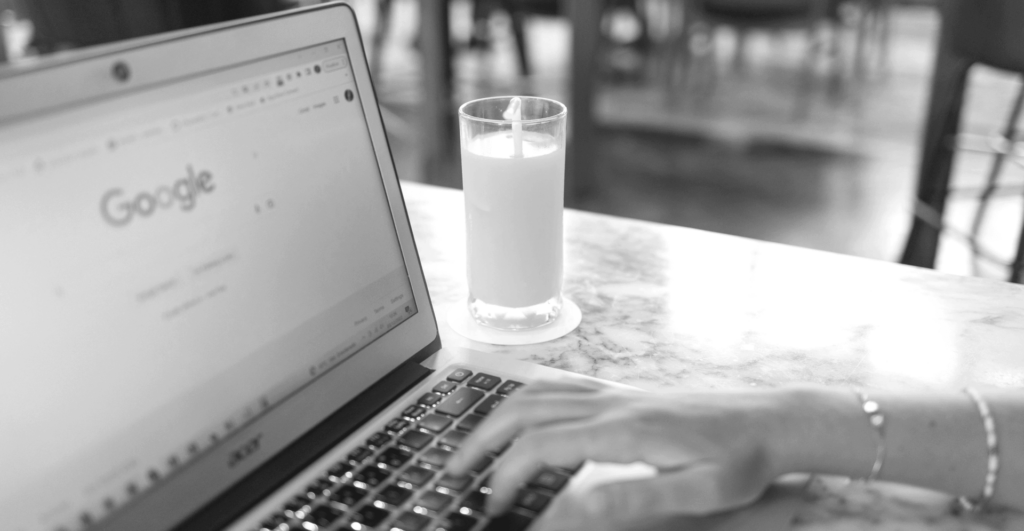 This picture of someone Googling something at a computer illustrates our topic: How to remove google search results.