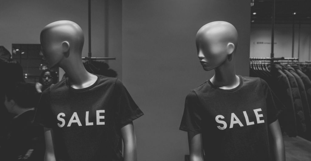 This image of ominous mannequins with "sale" written on their t-shirts illustrates our discussion topic: The scams targeting brands around Black Friday Sales, and how to stop them.