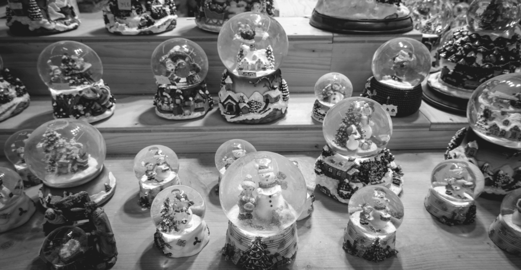 This image of an array of different festive snow globes highlights the diversity of seasonal celebrations, underscoring our discussion topic: How different cultures around the world celebrate the festive winter season.