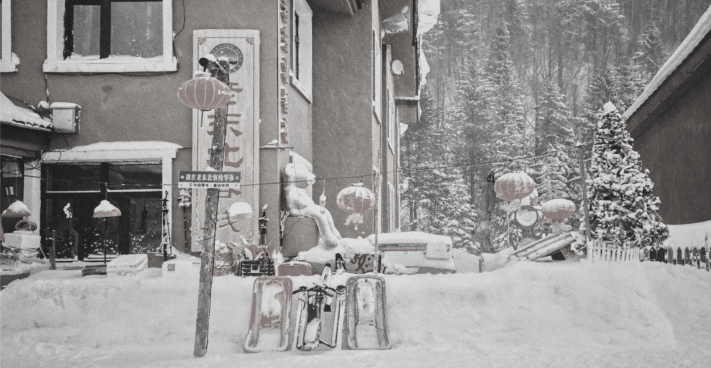 This image of festive lanterns and toboggans in snowy rural China highlights our discussion topic: How different cultures around the world celebrate the festive winter season.