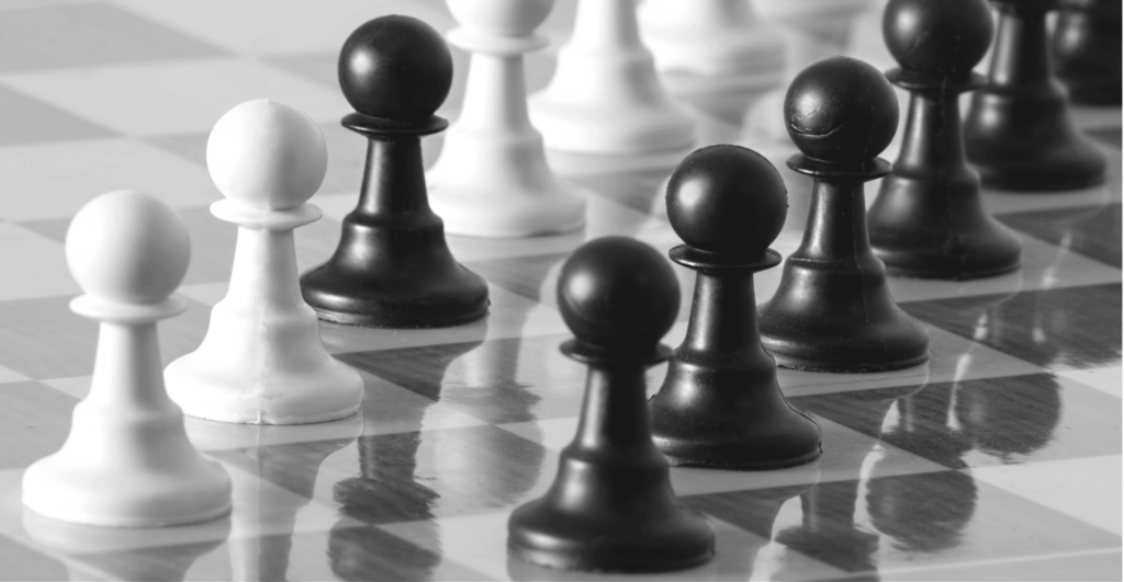 This image of pawns on a chessboard, with one conspicuous passed pawn, highlights the complexity of domain strategy, with a specific focus on EBRAND's COSMOS domain platform.