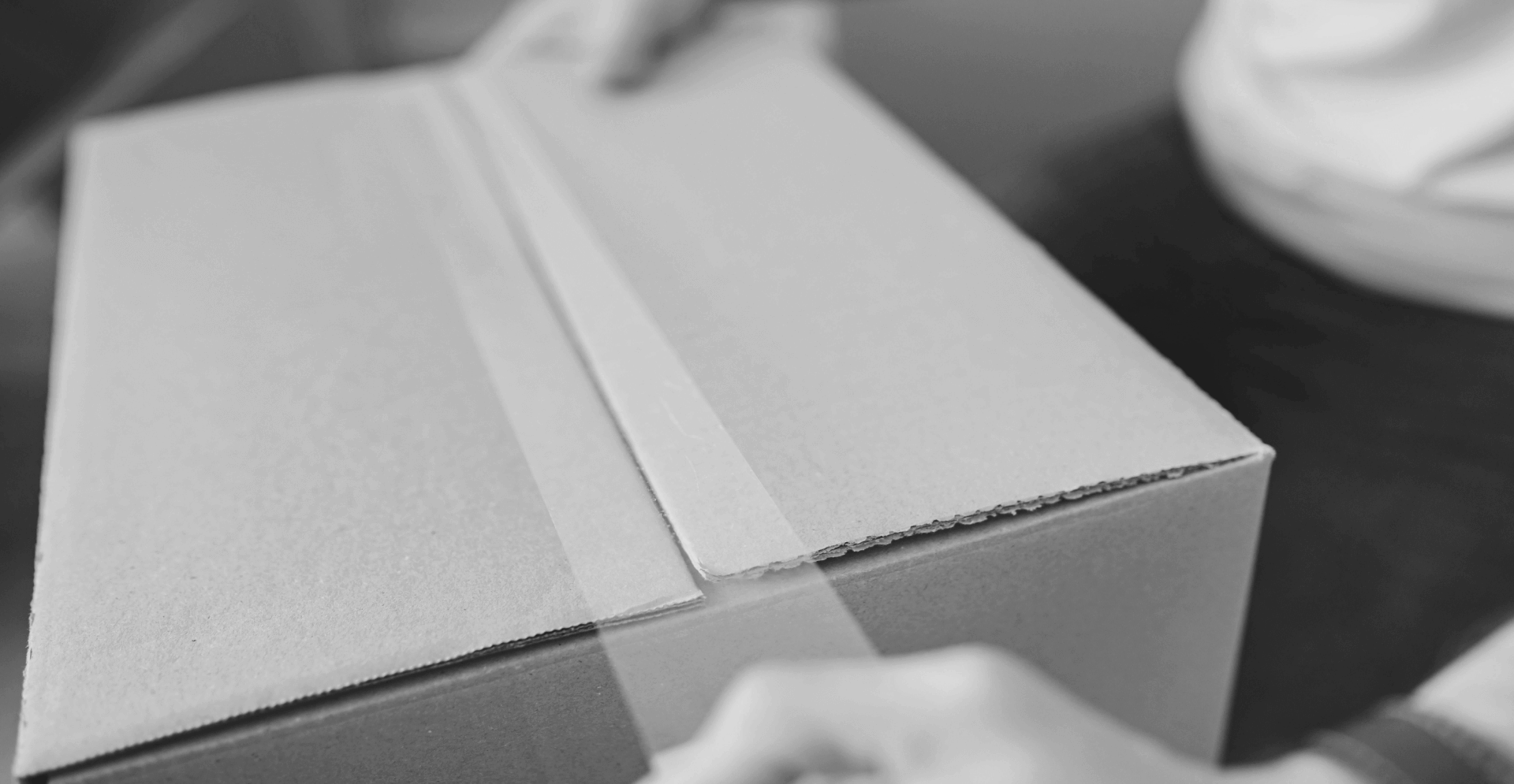 This image of a box being sellotaped shut highlights this piece's discussion topic: The importance of a test purchase for Online Brand Protection.