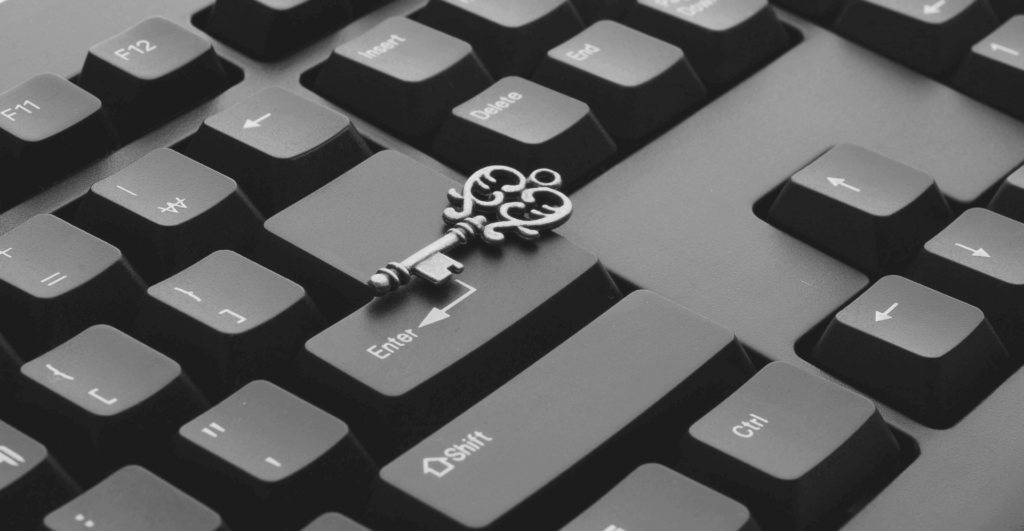 This image of an ornate metal key resting on a keyboard highlights our discussion topic: Stealer logs, and how organizations take a proactive stance against cybercriminals and malware attacks.