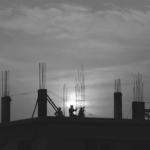 This image of two workers silhouetted on a construction site illustrates our discussion topic: Exploring the best ways to build stable, secure, forward-thinking DNS infrastructure.