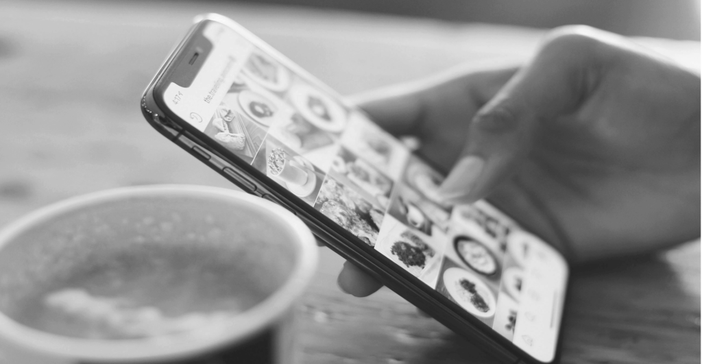 This image of someone browsing her phone illustrates our discussion topic: social media monitoring, social media scams, and malicious ads that target brands.