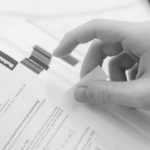 This image of a hand flicking through a tabbed binder illustrates our discussion topic: New gTLD applications, and the latest from ICANN's draft applicants guidebook.