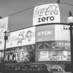 This image of an advertisement hoarding in a busy city square illustrates our discussion topic: Fake and infringing ads, and PPC brand protection solutions.