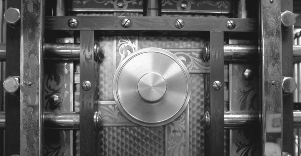 This image of a bank vault door illustrates our discussion topic: Modern banking scams, and how to tackle them.