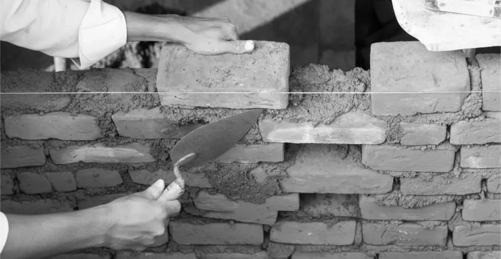 This image of a brick wall being built illustrates our discussion topic: how to protect your future across brands, domains, and digital risk.