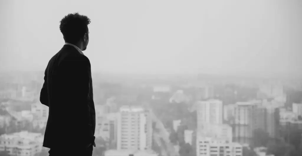 This image of a businessperson looking out at a city
illustrates our discussion topic: how to protect your future across brands, domains, and digital risk.