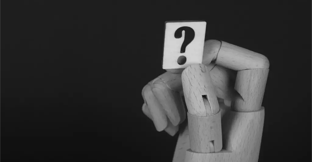 This image of a robotic hand with a question mark tile illustrates our discussion topic about CEO fraud.