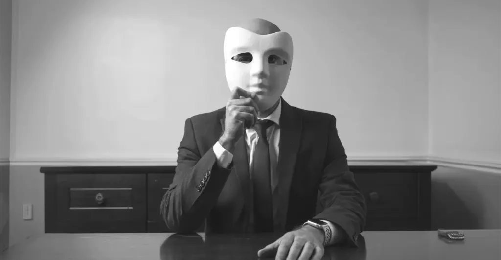 This image of a masked, suited man illustrates our discussion topic about CEO fraud.