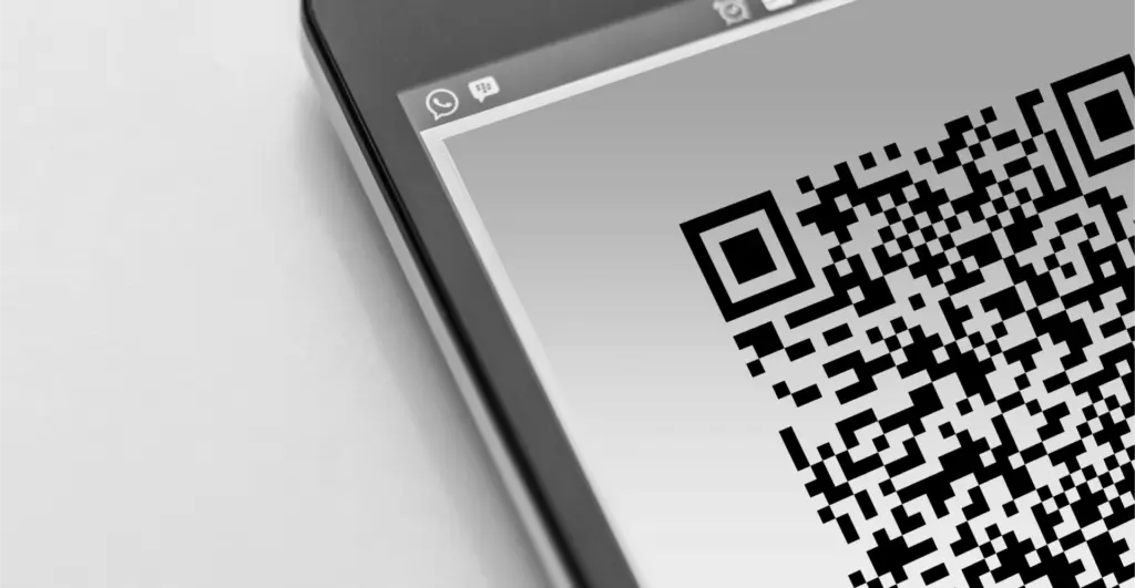 This image of a qr code on a phone illustrates our discussion topic: scams on Linktree and how to fight back.