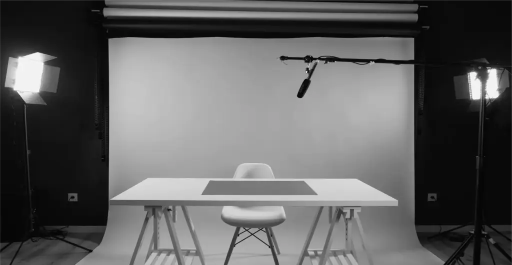 This image of an empty livestream set with table and mic illustrates our discussion topic on livestream counterfeiting and how brands can stay safe.