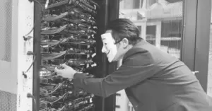 This image of a masked man at a server bank illustrates our discussion topic about phishing as a service.