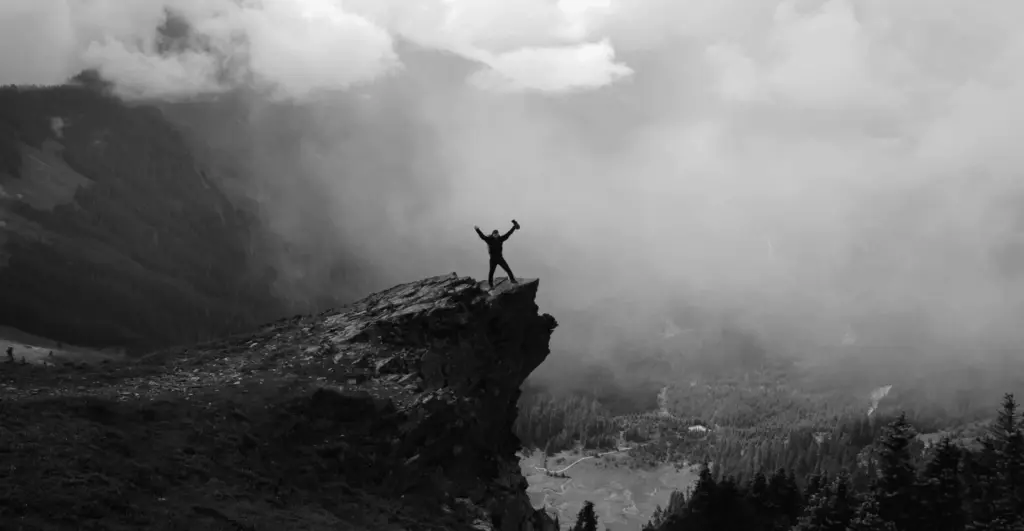 This image of a hiker celebrating on a mountaintop illustrates our discussion topic: The ICANN reveal of new gTLDs, and what that means for you.