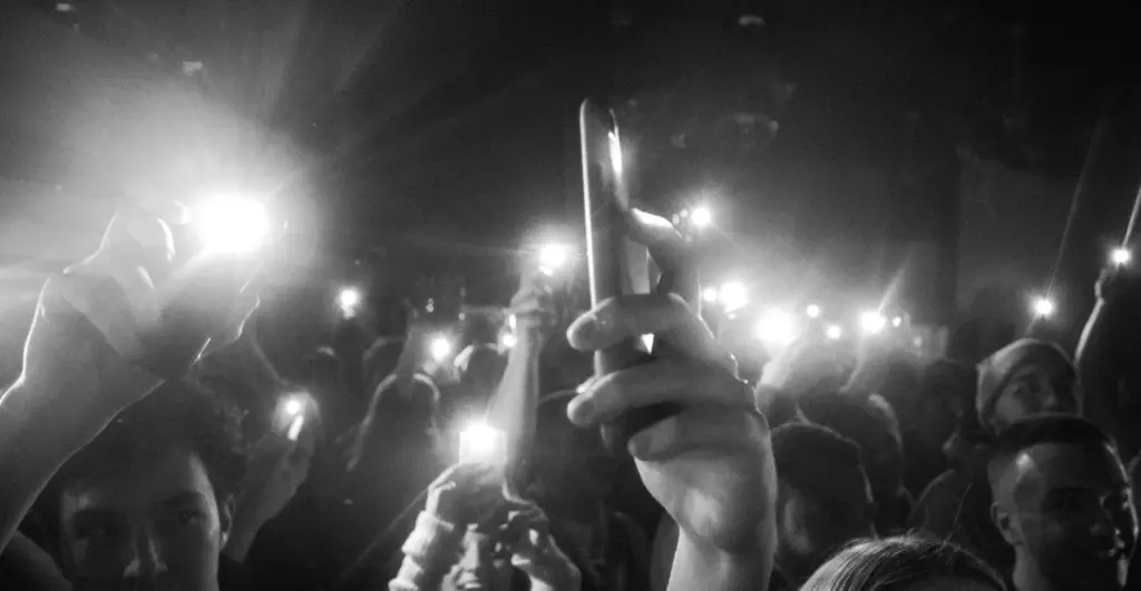 This image of a blur of paparazzi illustrates our discussion topic: Celebrity impersonations, CEO fraud, and identity protection.