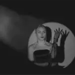 This image of a glamorous model in the spotlight illustrates our discussion topic: Celebrity impersonations, CEO fraud, and identity protection.