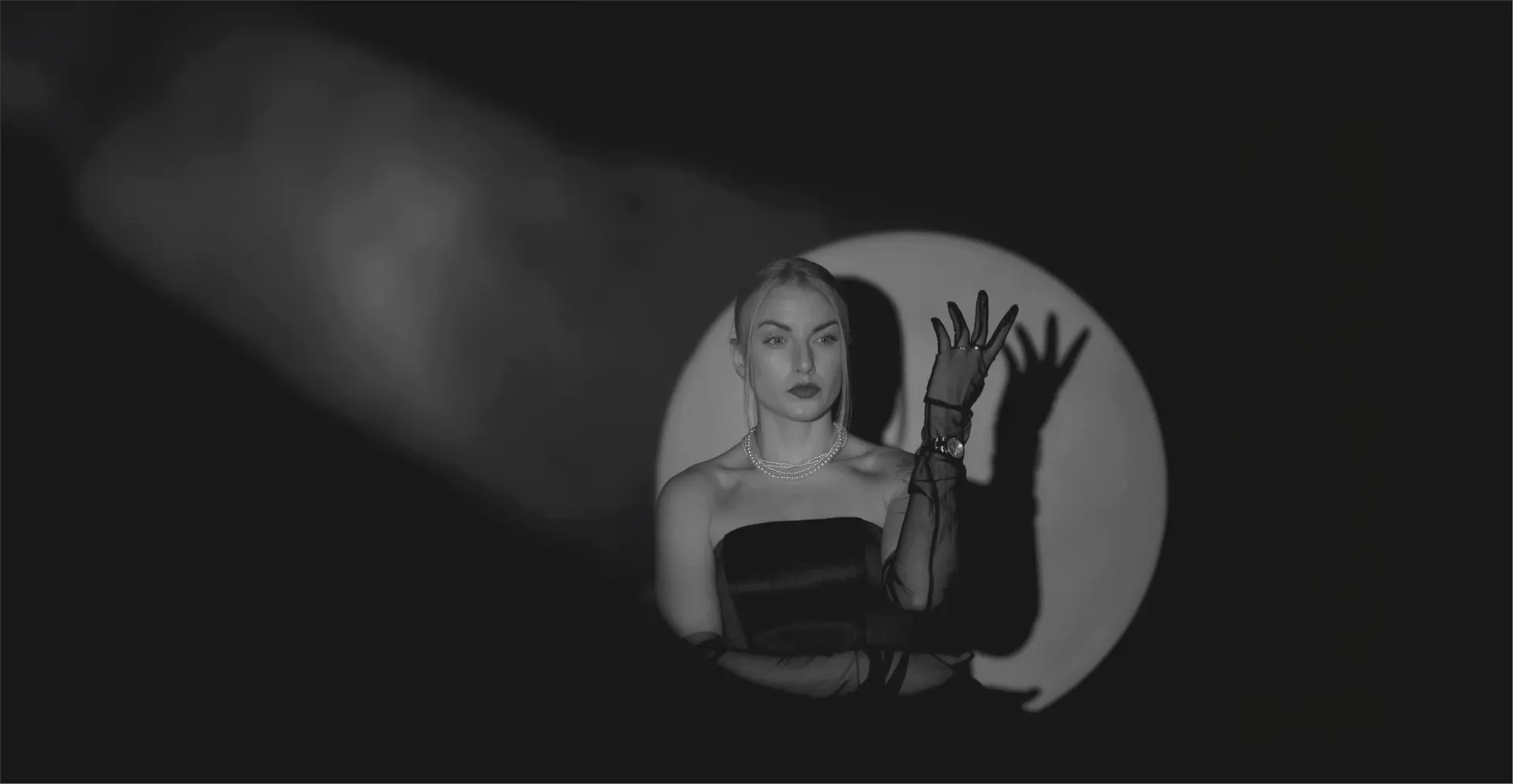 This image of a glamorous model in the spotlight illustrates our discussion topic: Celebrity impersonations, CEO fraud, and identity protection.